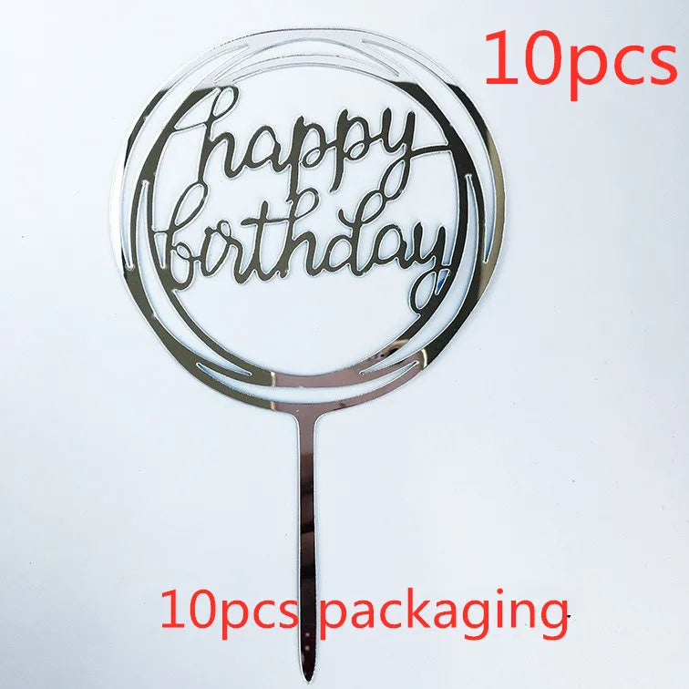 A clear acrylic birthday cake topper with the words Happy Birthday on a stick, shown against a white background.
