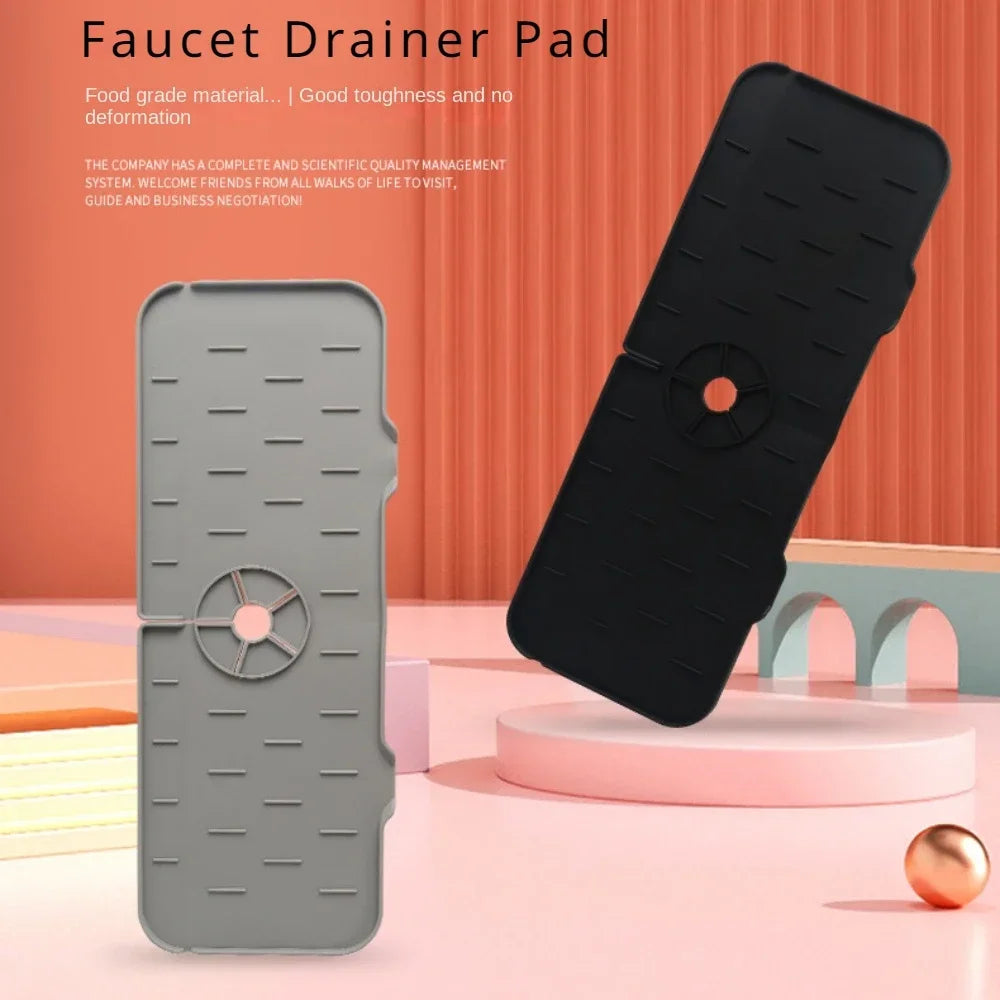 A black silicone faucet drainer pad is shown next to a smartphone, highlighting its toughness and food-grade material.