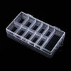 A clear plastic organizer box with multiple compartments for storing nail art supplies.