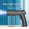A black nano spray gun is shown next to a clear bottle, demonstrating blue light fog output.