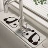 A modern chrome faucet mounted on a white mat, used as a natural diatomaceous earth faucet mat.