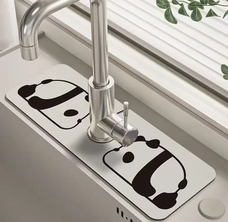 A modern chrome faucet mounted on a white mat, used as a natural diatomaceous earth faucet mat.