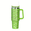 A lime green insulated stainless steel tumbler with a leopard print pattern and a handle and straw.