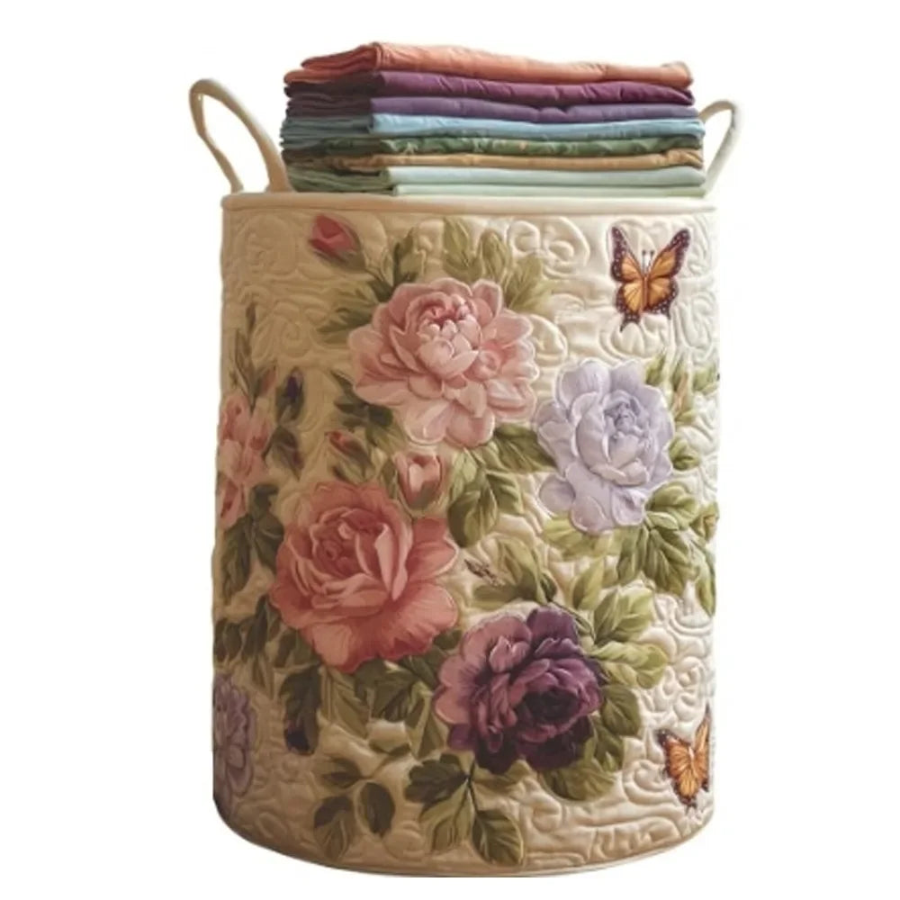 A beige quilted laundry basket with handles filled with folded purple and green fabric.