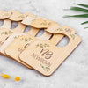 A set of wooden baby closet dividers with engraved names and the word newborn