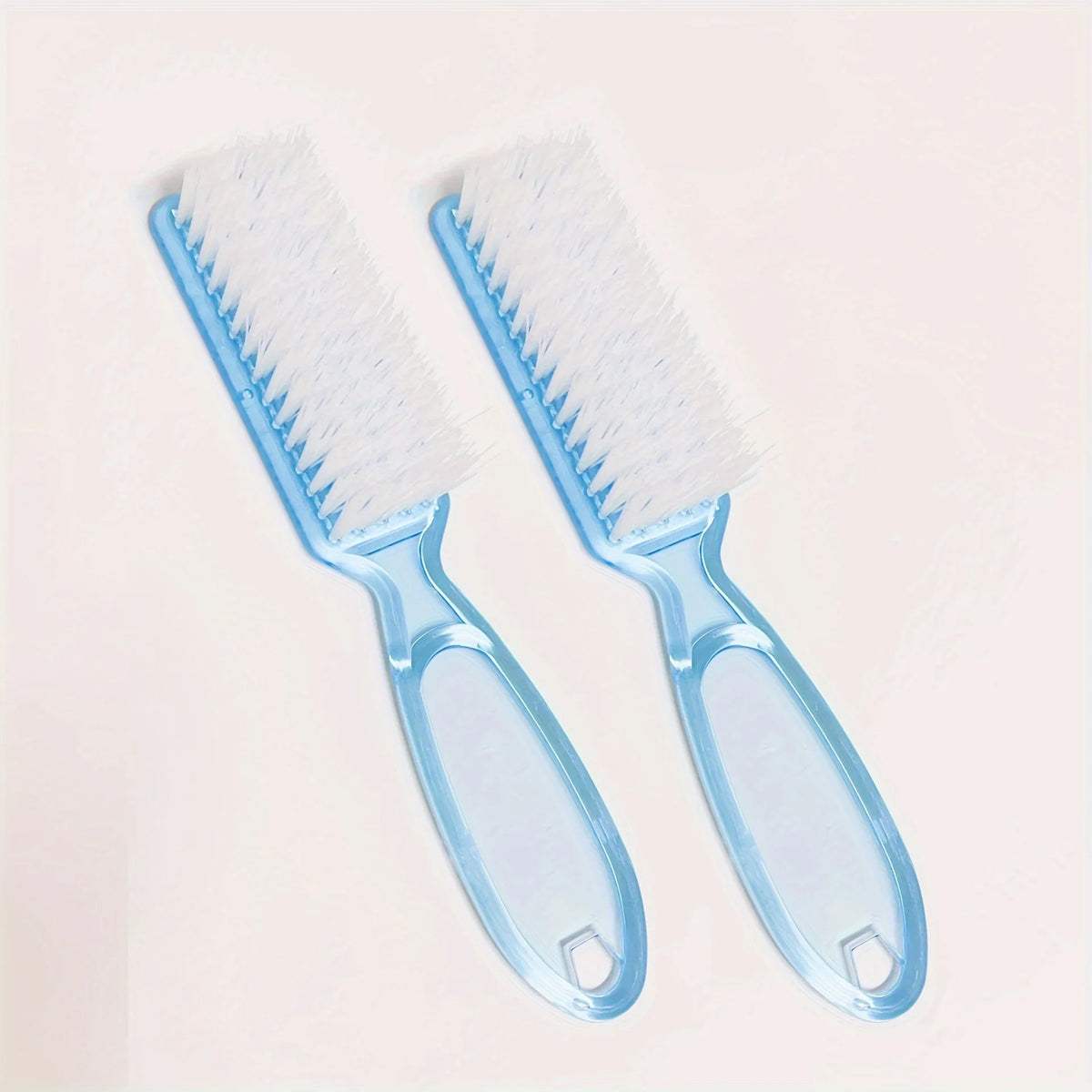 A pair of light blue silicone brushes with white bristles for nail art and dust cleaning.
