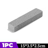 A rectangular gray pumice stone stick used for cleaning household stains.