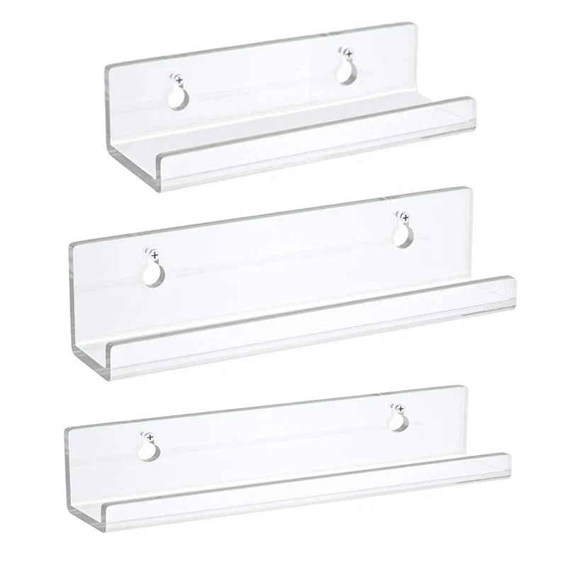 Trois présentoirs flottants en acrylique transparent pour bijoux ou petits objets.