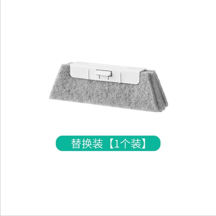 A gray window and gap cleaning brush with a white handle.