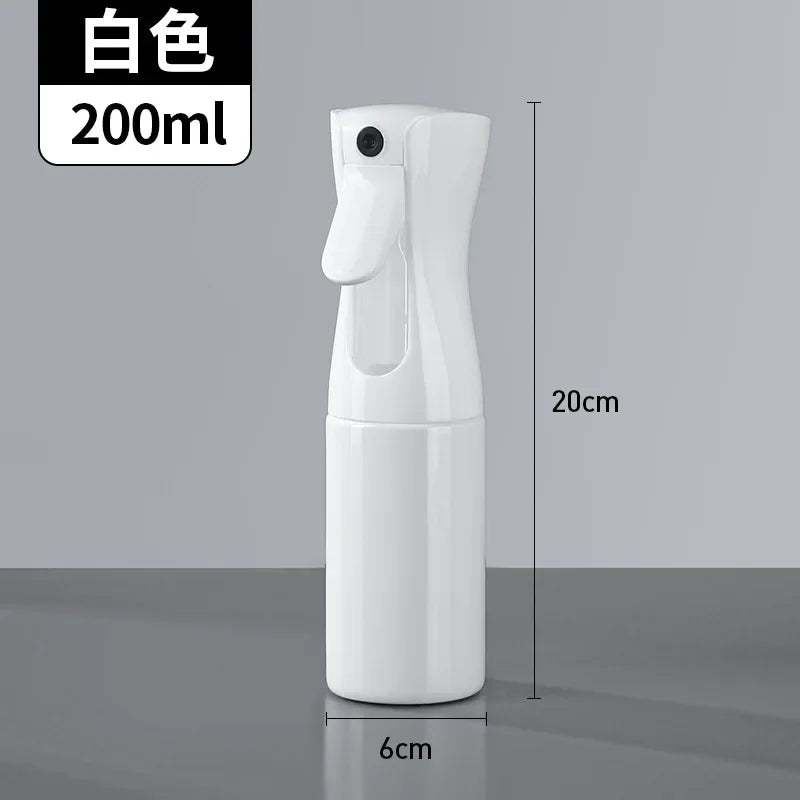 A white refillable continuous mist spray bottle for hair and beauty, shown in a vertical view.