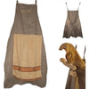 A gray chef apron with a beige fabric insert and a yellow chef hat.