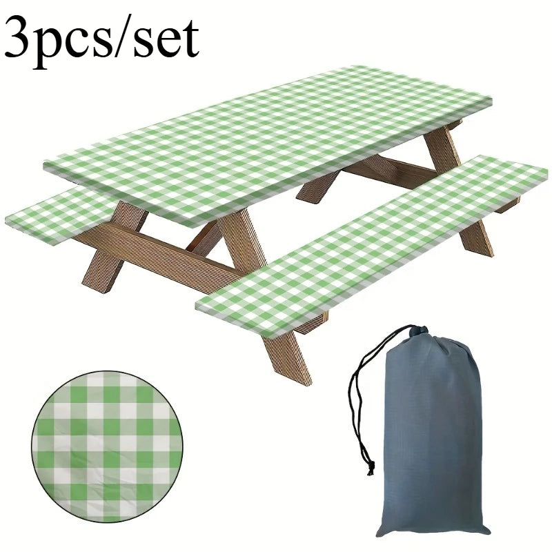 A set of three plaid tablecloths or mats, featuring a green and white checkered pattern, displayed with wooden supports.