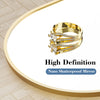 Nahaufnahme eines goldfarbenen Rings mit Diamantakzenten auf weißem Hintergrund.