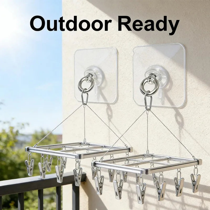 Outdoor ready stainless steel wall hooks mounted on a light-colored wall.