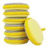 A stack of yellow and silver double-sided kitchen cleaning towels and dish sponges.