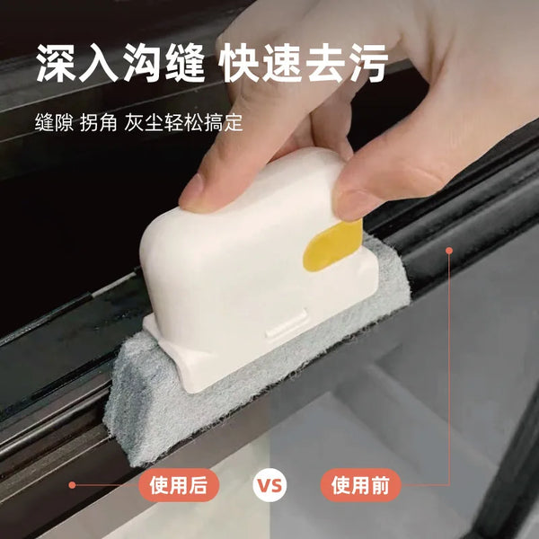 A hand is using a white cleaning brush to quickly clean deep grooves in a track or groove.