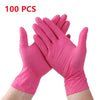 A pair of pink disposable nitrile cleaning gloves shown on a hand.