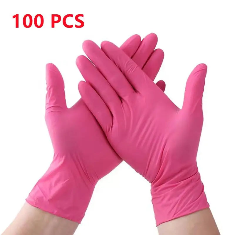 A pair of pink disposable nitrile cleaning gloves shown on a hand.