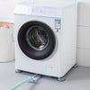 White washing machine with anti-vibration feet installed on the floor.