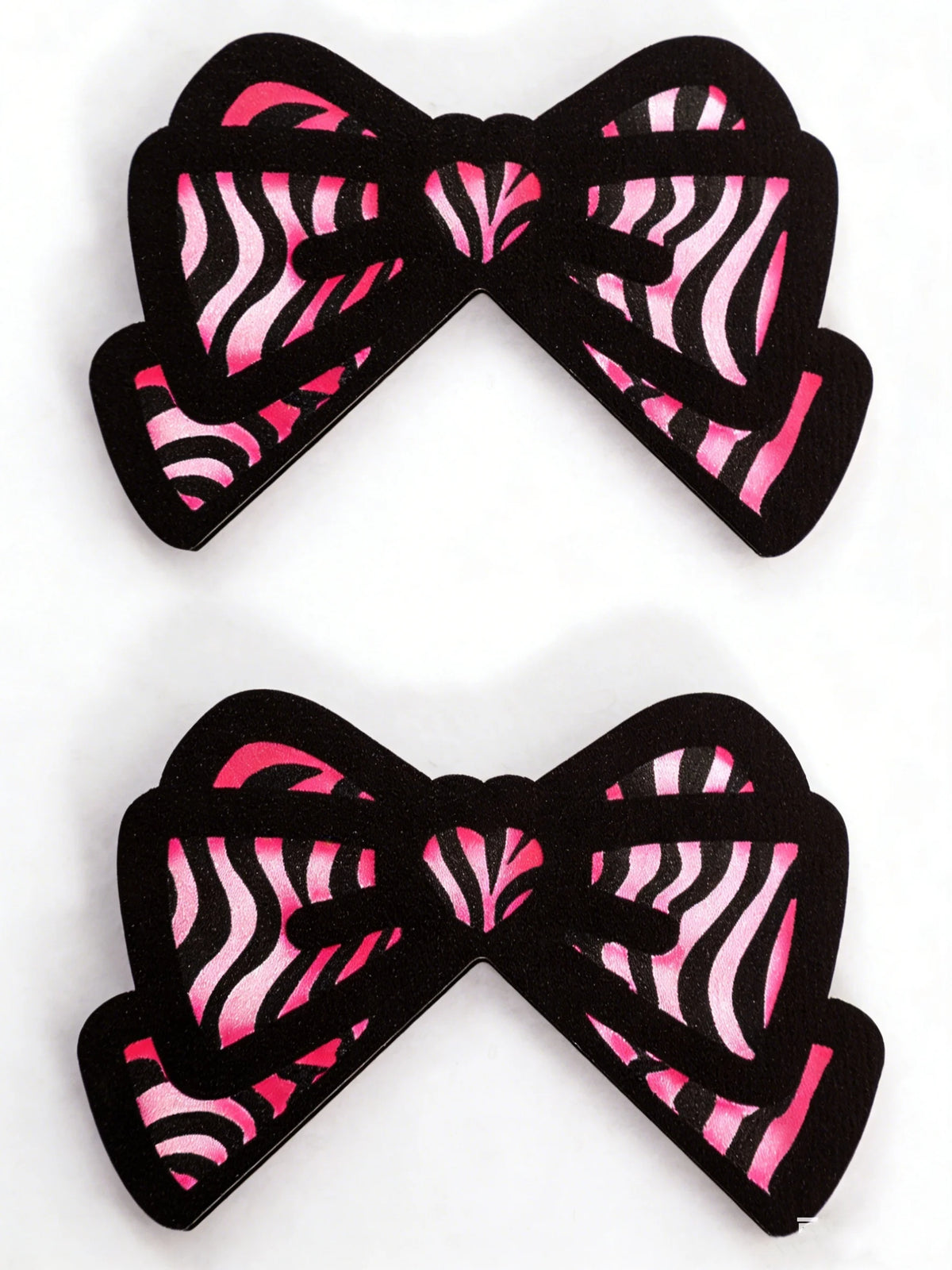 Moniteur en forme de nœud noir décoré de rayures zébrées roses.