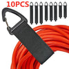 A black nylon cord organizer strap is shown attached to a red electrical cord, with multiple metal hooks displayed nearby.