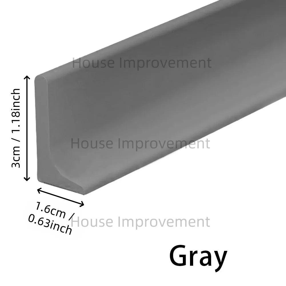 Gray silicone shower threshold water barrier strip shown in profile view.