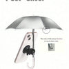 A silver umbrella shade is shown with a phone mount and suction cups for protection.