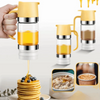 A hand is dispensing golden honey from a glass dispenser onto a stack of pancakes.