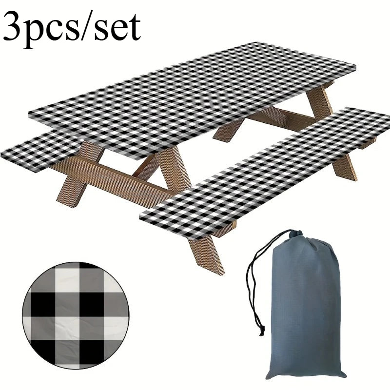 A set of three plaid checkered tablecloths with wooden frames for outdoor use.