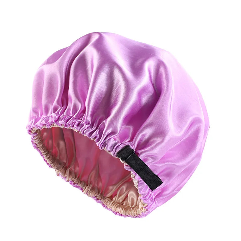 A vibrant purple satin sleep cap with a gathered edge and a black tie, designed for hair protection.