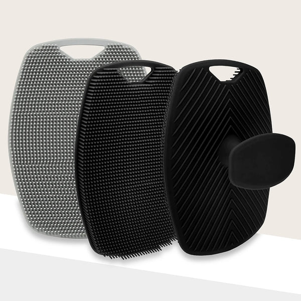 A set of black and silver silicone body scrub brushes for skin exfoliation