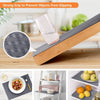 A wooden shelf liner is shown protecting a glass from slipping on a wooden table, demonstrating a strong grip for kitchen and