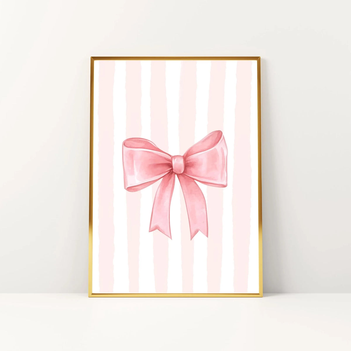 Pink striped canvas wall art featuring a pink bow design in gold frame