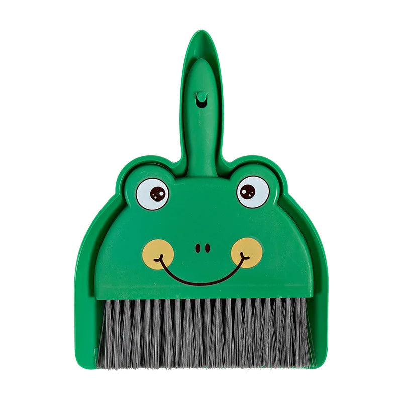 A green cartoon animal broom with a brush and dustpan attached.