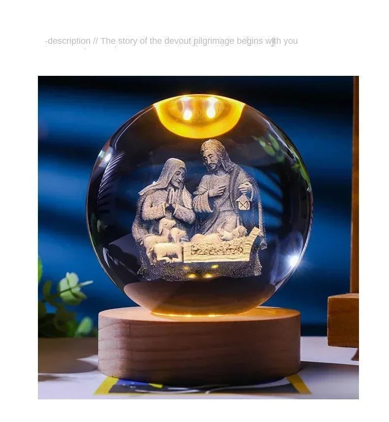 An illuminated crystal ball set featuring a depiction of Jesus and Mary for spiritual devotion.