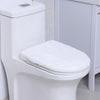 A white protective toilet seat cover is placed on a white porcelain toilet bowl.