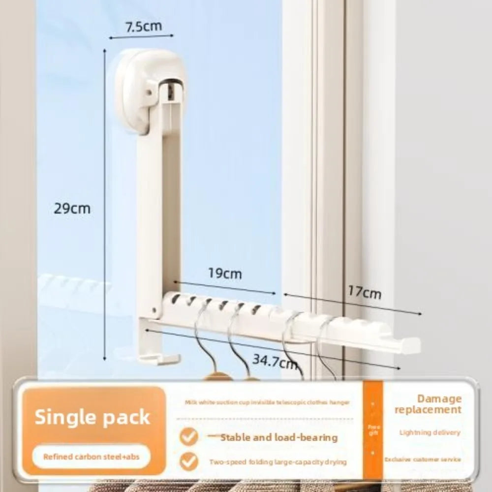 A white foldable wall drying rack with suction cups shown against a window frame.