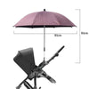 Paraguas para cochecito rosa con toldo negro y manija telescópica.