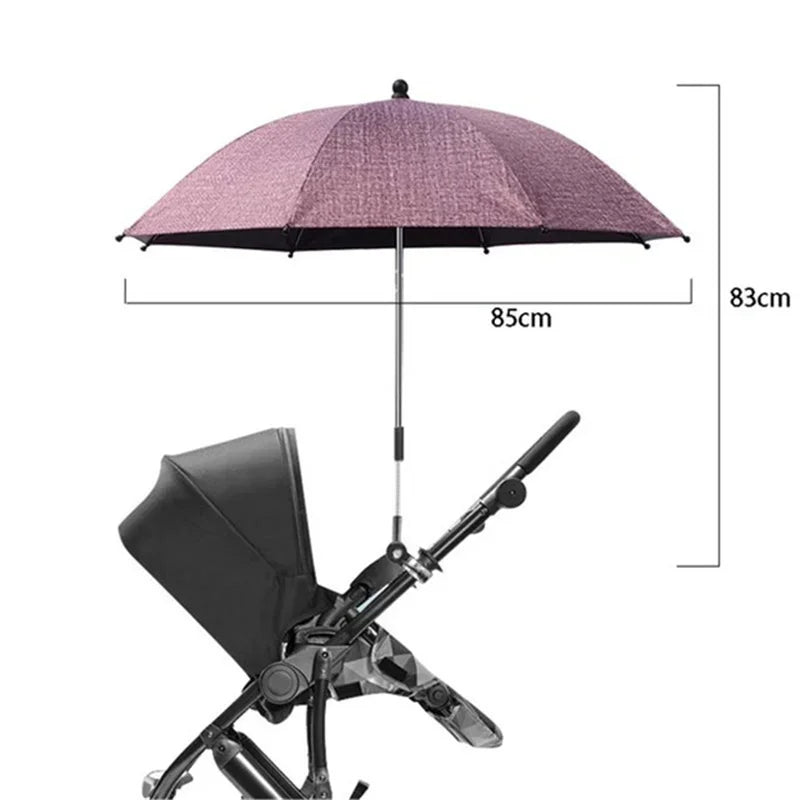 Paraguas para cochecito rosa con toldo negro y manija telescópica.