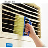 A hand is using a blue multi-functional cleaning brush to clean the slats of a window blind.