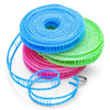 A spool of blue, green, and pink portable windproof clothes drying line string.