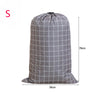 A gray drawstring storage bag for laundry and bedding, shown from the front.