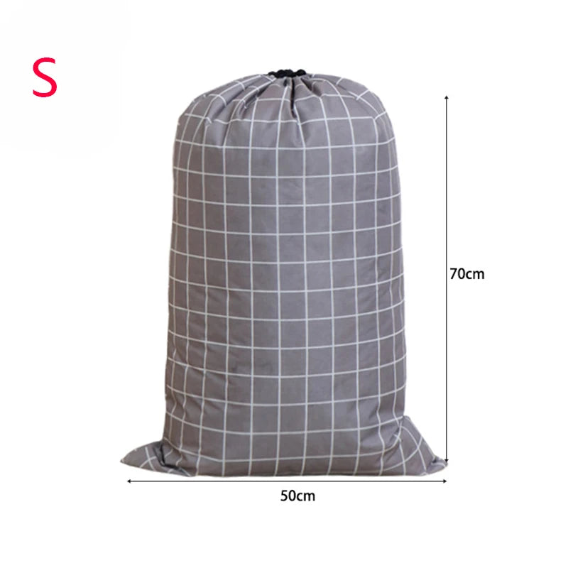 A gray drawstring storage bag for laundry and bedding, shown from the front.