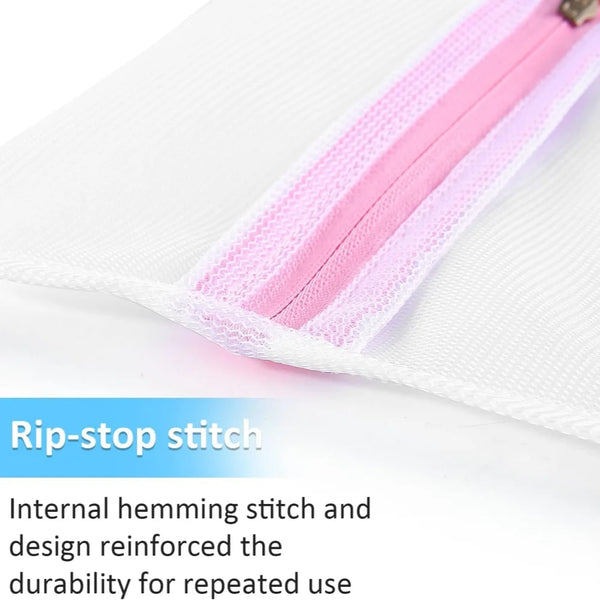 Close-up of a white mesh laundry bag with pink piping and a visible rip-stop stitch detail.