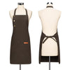 A dark brown canvas apron displayed on a mannequin, featuring adjustable straps and a tie closure.