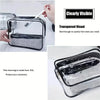 A clear plastic zipper tote bag is shown with a mesh lining, used for organizing cosmetics and travel items.