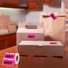 Several brown cardboard boxes and paper bags are visible, marked with fluorescent pink HOT stickers.