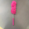 A bright pink flexible microfiber cleaning duster brush with a fluffy head and a pink handle.