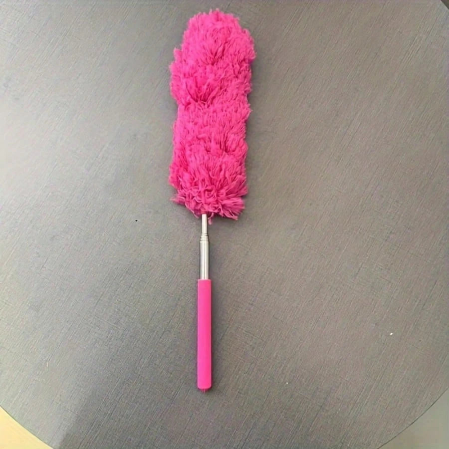 A bright pink flexible microfiber cleaning duster brush with a fluffy head and a pink handle.