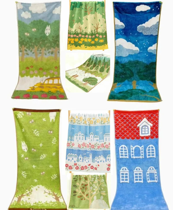 A collection of square towels featuring embroidered scenes of nature, including forests, fields, and landscapes.